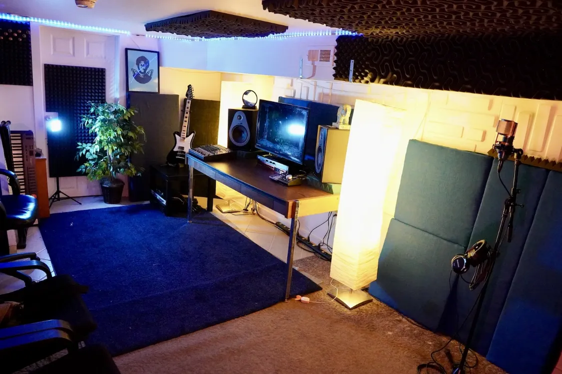 recording studio desk, speakers and microphone